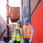 Foreman man and worker working checking at Container cargo,Logistics import export shipping concept.